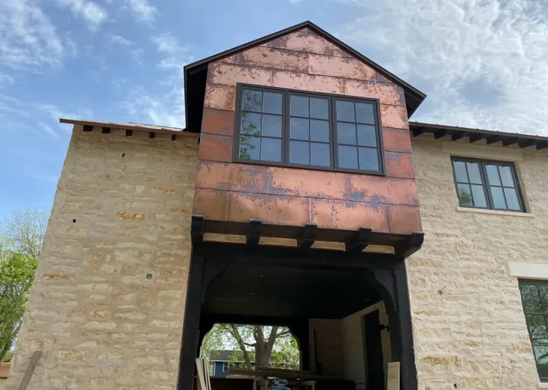 Copper metal panel facade on a stone building for Metal Roof Coating in Babylon